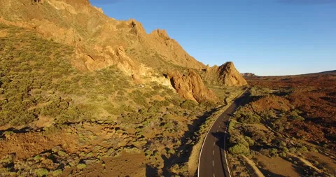 Flying over a rocky mountain peak on a drone. Stock Footage 237479652