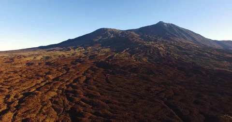 Flying over a rocky mountain peak on a drone. Stock Footage 237480297