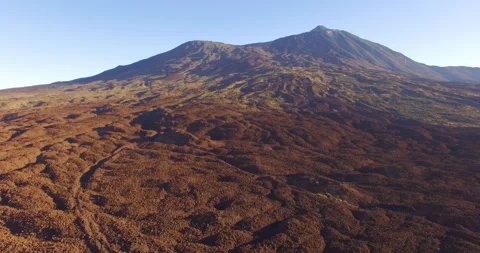 Flying over a rocky mountain peak on a drone. Stock Footage 237480794