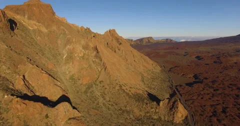 Flying over a rocky mountain peak on a drone. Stock Footage 237481191
