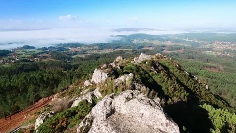 Flying over rocky mountain ridge above misty valley in Galicia Stock Footage 336719060