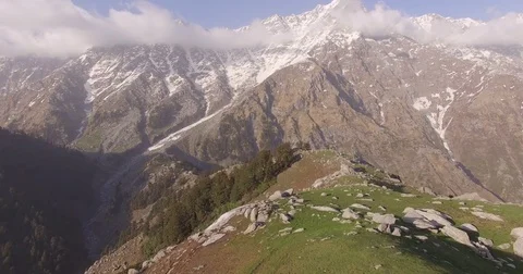 Flying Over Rocky Snow-Capped Mountains Stock Footage 81003557