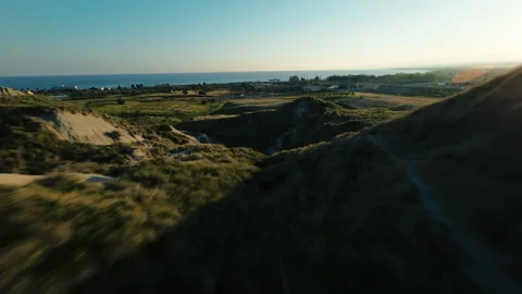 Flying over the rolling hills of the badlands Stock Footage 274349746