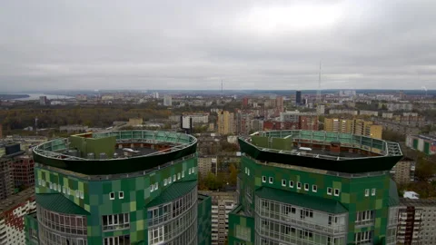Flying over the roofs of two green skyscrapers. Stock Footage 131765505