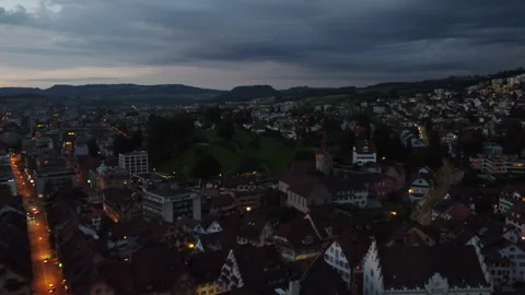 Flying over the rooftops of Zug during sunset Stock Footage 332528378