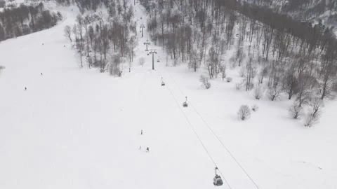 Flying over rope-way with gondolas at mountain resort Crystal Park in Bakuriani Stockbeeldmateriaal 150524050