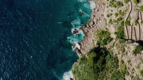 Flying over Rough Limestone Rock Coastline of Capri Island With Cliffs and Video stock 330854847
