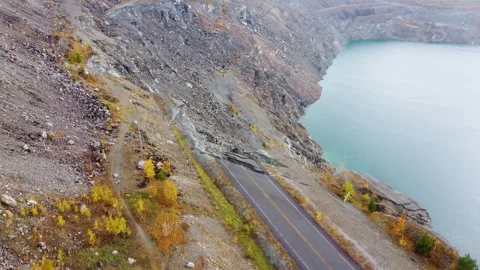 Flying over route destroyed by landslide at abandoned Jeffrey Asbestos Mine Stock Footage 297737385