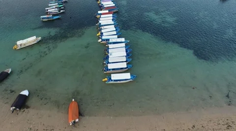 Flying over a row of boats in a harbor Stock Footage 61950360
