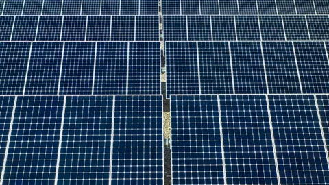 Flying over rows of solar panels Stock Footage 205047570