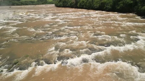 Flying over a rushing river and waterfall. Salto Saudades. 4K Video stock 233219665