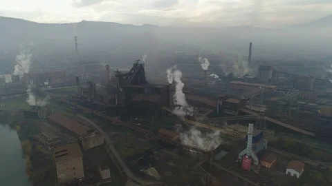 Flying over rusty steel manufacturing plant, air pollution heavy industry Europe Video stock 85831553
