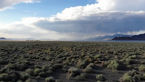 Flying Over Sage Brush Towards Pyramid Lake Nevada with Stormy Skies Video stock 110776066