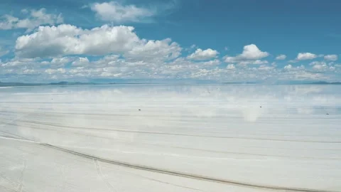 Flying over of Salar De Uyuni reflection water salt lake, desert in Bolivia 4K Stock Footage 198317545