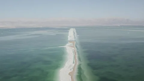 Flying over a salt formation in the Dead Sea Stock Footage 240311668