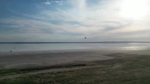 Flying over salt lake in evening Stock Footage 309744863