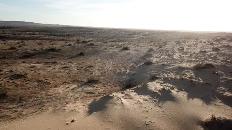 Flying over sand dunes Stockbeeldmateriaal 110960997