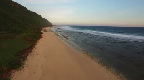 Flying over a sandy beach in Bali, Indonesia Stock Footage 61951816