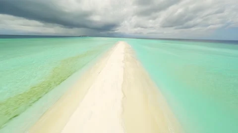 Flying over a sandy beach in the Maldives Video stock 239337178