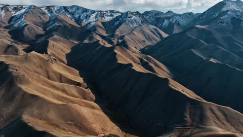 Flying over a sandy desert among rocks Stock Footage 297124760