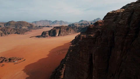 Flying over a sandy desert among rocks Stock Footage 297127357