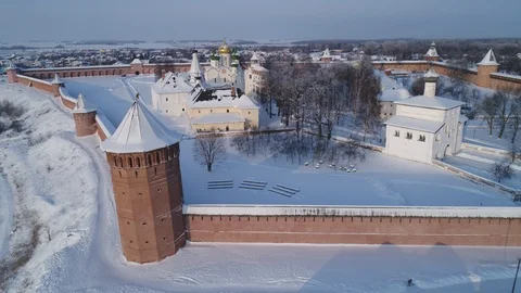 Flying over the Savior Euthymius monastery in Suzdal on a winter day Stock Footage 101092625