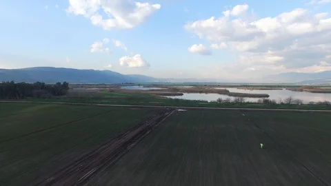 Flying over the scarecrow in the fields of Hula Valley. Israel.DJI-0030-06 Stock Footage 106615481