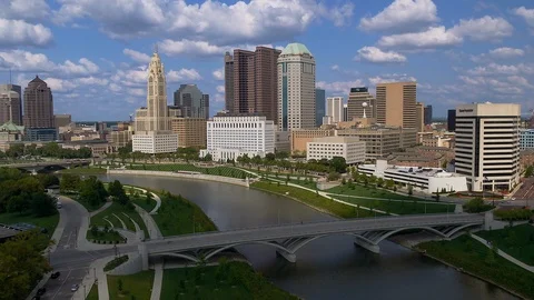 Flying over the Scioto river pulling away from downtown Columbus, Ohio. Stock Footage 100655616