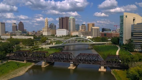 Flying over the Scioto river towards downtown Columbus, Ohio Stock Footage