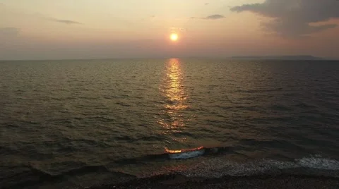 Flying over the sea to the setting sun Stock Footage 61946765