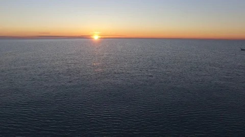 Flying over the sea at sunset Stock Footage 106211223