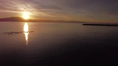 Flying over the sea to the sunset Stock Footage 205042423