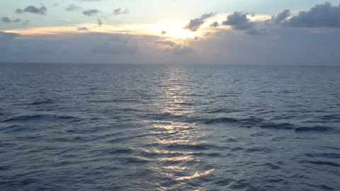 Flying over the sea surface during sunset. Stock Footage 99729443