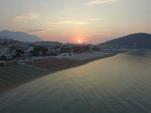Flying over the sea towards the beach at dawn Stock Footage 72330403