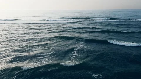 Flying over the sea waves. Blue sea and the sky at sunset. Stock-Footage 219968238