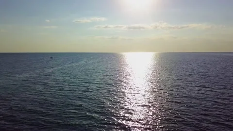 Flying over the sea waves during sunset Stock Footage 157105910