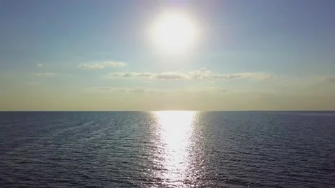 Flying over the sea waves during sunset Stock Footage 157106396
