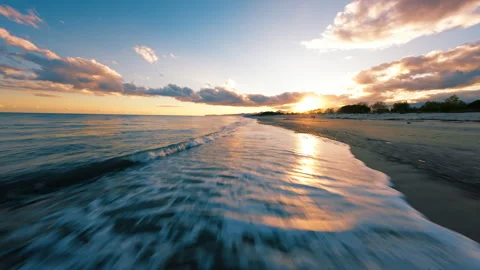 Flying over sea waves at sunset light Stock Footage 301939297