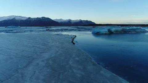 Flying over seals on a glacier ice sheet lagoon in Iceland Stock Footage 122298565