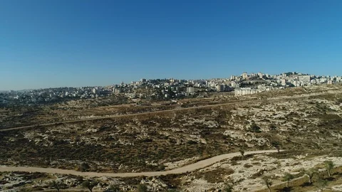Flying over the security fence into Bethlehem. West Bank. DJI_0079-01 Stock-Footage 104496194