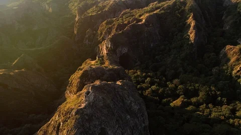 Flying over the sharp rocks with ancient little fortress in georgia Stock Footage 100246218