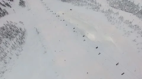 Flying over the ski slope and chair lift Stock Footage 60664167