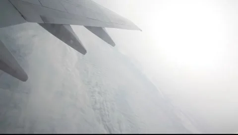 Flying over the sky with snow landscape in plane 4 Stock-Footage 7908039