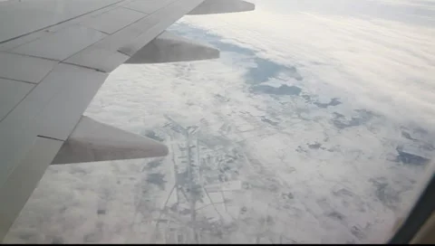 Flying over the sky with snow landscape in plane 3 Stock-Footage 7908136