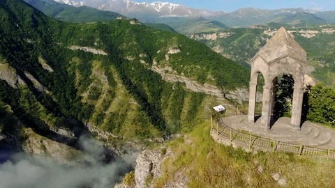 Flying over small chapel at the edge of  Vorotan canyon, Armenia Stock Footage 95541545