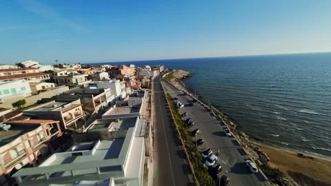 Flying over small coastal town Stock Footage 242420380