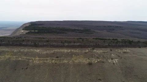 Flying over a small rock with trees Stock Footage 152982088