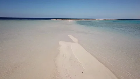 Flying over small strip of sand connecting two islands in Saudi Arabia Video stock 125774755