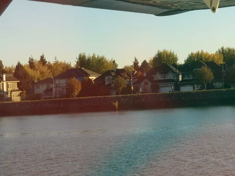 Flying over small town water townhouses autumn Stock Footage 81804450