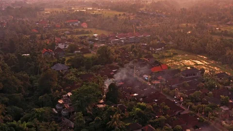 Flying over a smoking house after a fire in Bali Indonesia Stock Footage 102511853